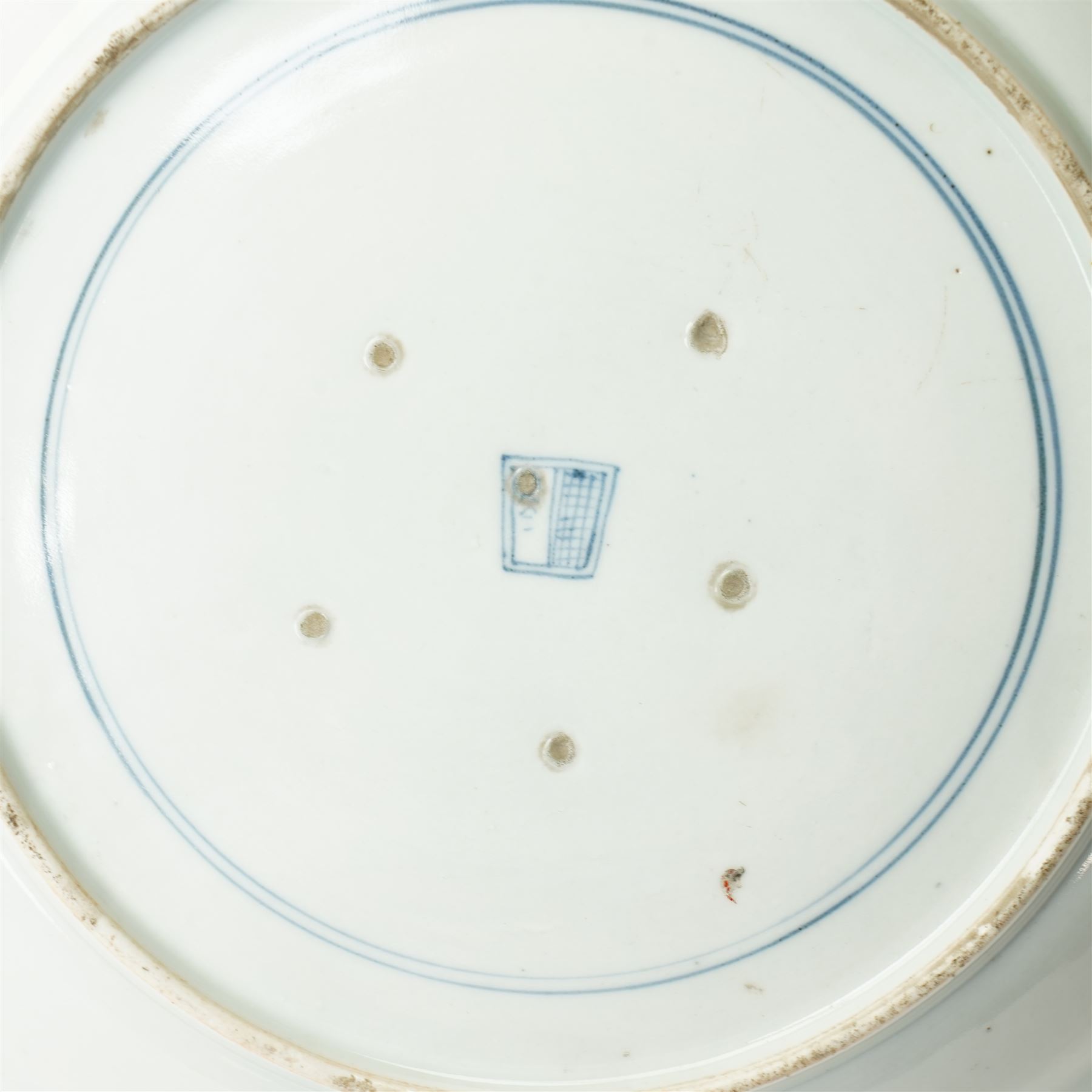 Japanese 19th century Arita style dish, painted centrally in blue and white with a lady carrying peaches, marked in blue to base, W28.5cm 