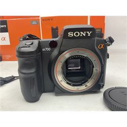 Sony Alpha A700 camera body, serial no 2340937, Sony Alpha A77 camera body, serial no 0715406, together with Sony angle finder and two firm holding grips, all with original boxes  