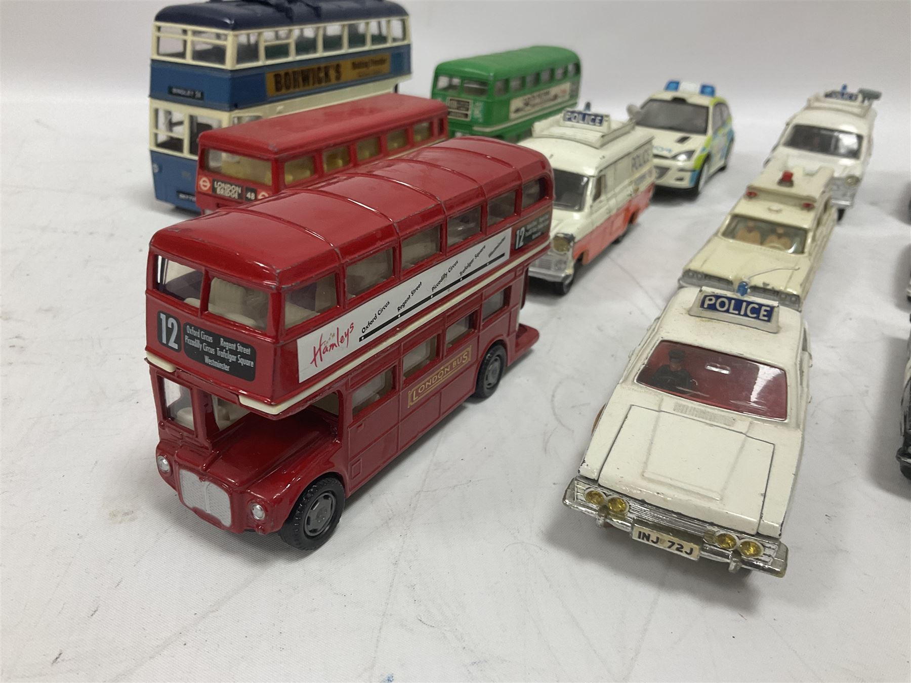 Corgi/Dinky - twenty-four unboxed and playworn die-cast models, predominantly emergency vehicles and buses; including Autocar Isobloc, Superior Criterion Ambulance, Ford Transit Police Vans, Chevrolet Impalas, Minissima, Ausin Mini Police van etc (24)