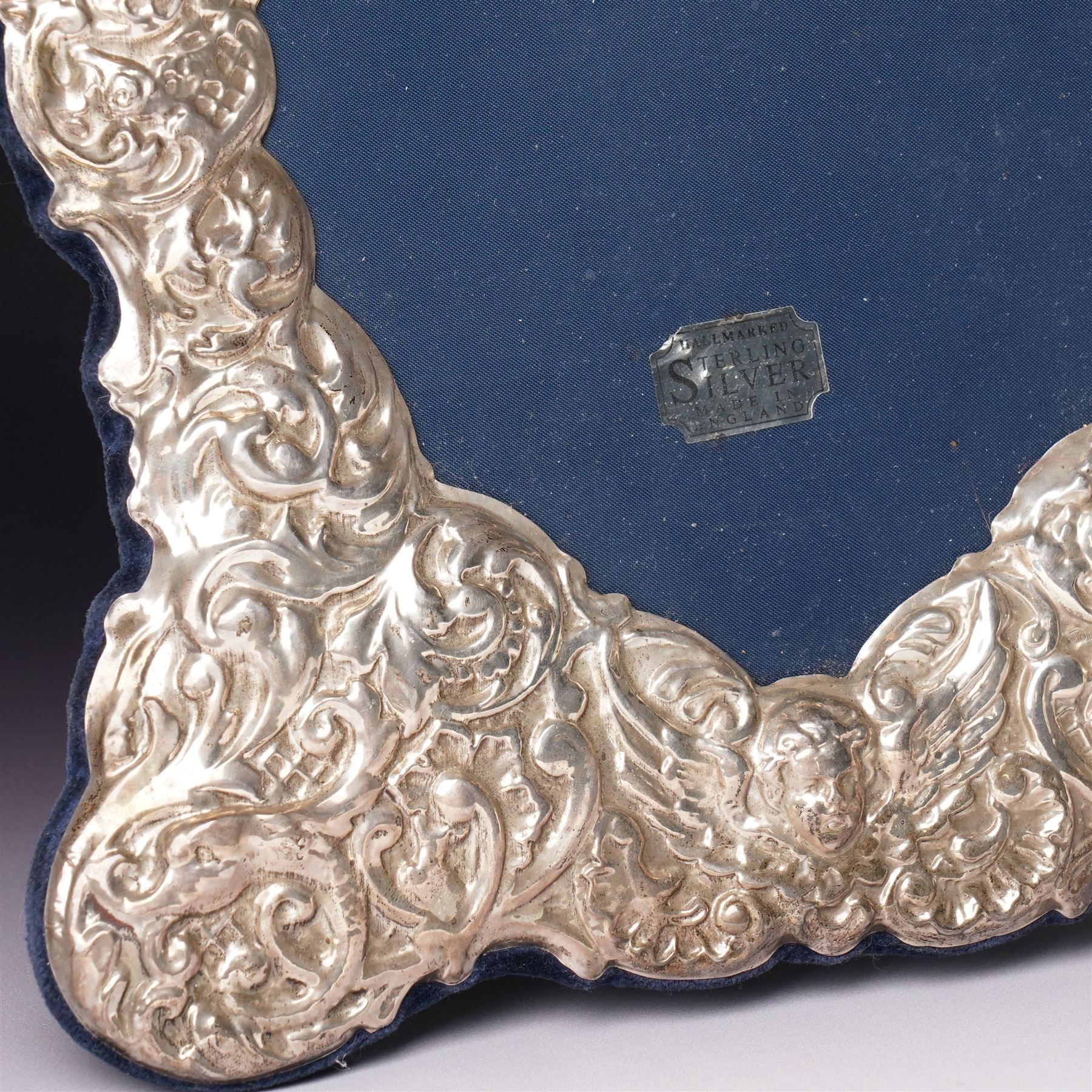 Silver heart shape photograph frame with embossed decoration on easel stand H29cm overall Sheffield 1993 Maker Carr's of Sheffield