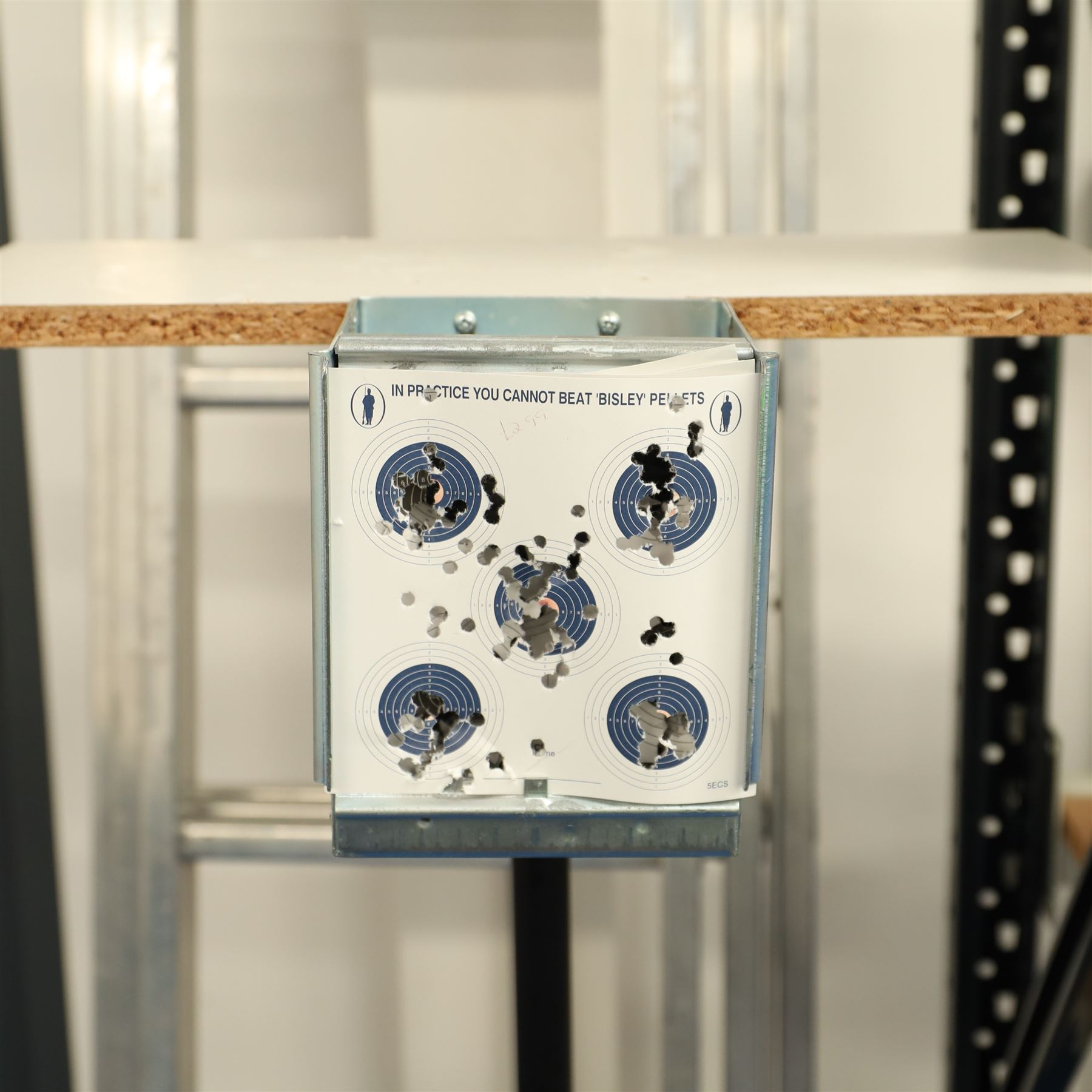Air gun accessories; Remington Auto Reset crow target, MCM “Predator” shooting rest, paper target holder mounted to a target with additional paper targets