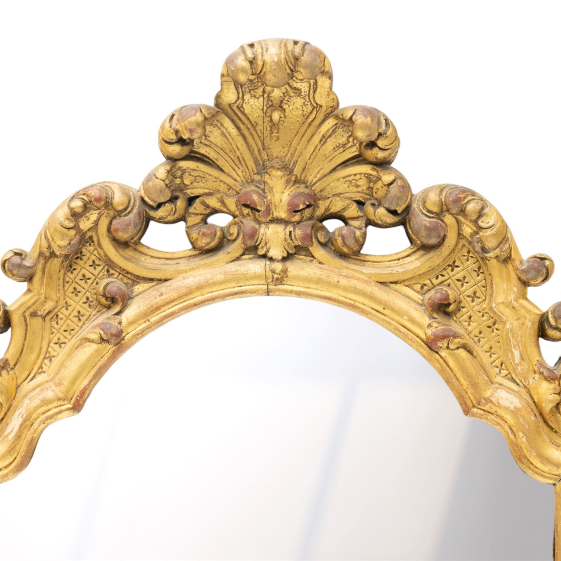 19th century Italian Baroque Revival carved giltwood and gesso wall mirror, the large acanthus leaf pediment flanked by C-scrolls and further acanthi motifs, enclosing a shaped arch plate with moulded slip, flanked by down-scrolls of acanthi with emerging flowering branches, on a stepped base
