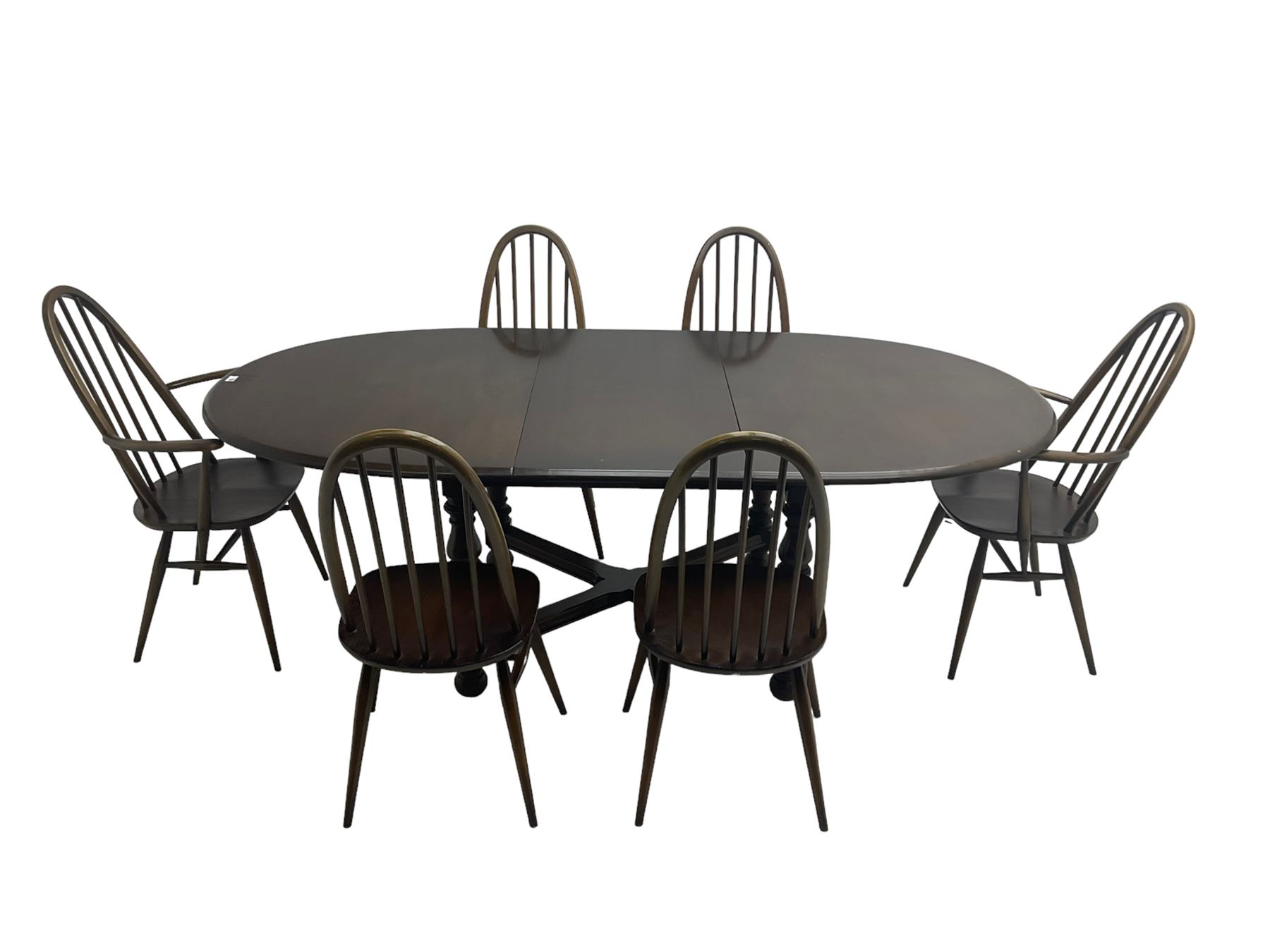 Ercol - 'Old Colonial' 705 elm extending dining table, oval top with hidden leaf, raised on turned supports united by X-stretcher (W163cm D108cm H72cm); and Ercol - set six  (4+2) dark elm 'Quaker Back Windsor Dining Chairs', hoop and stick backs 
