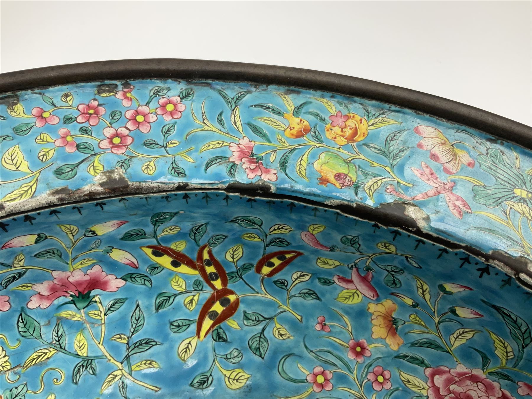 18th/19th century Chinese Canton enamel basin, the circular basin with flat everted rim, decorated with scrolling foliate and fruit decoration on a blue ground, D43cm