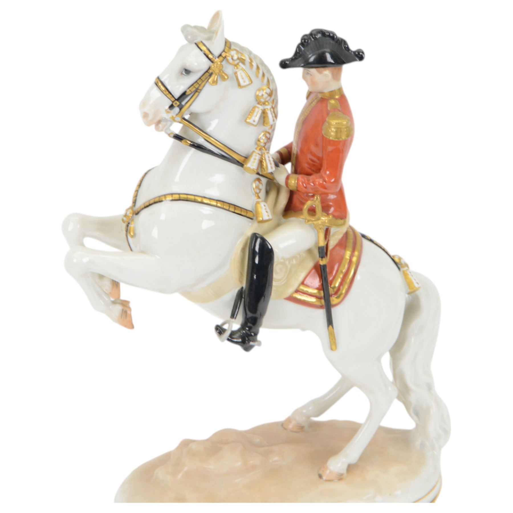Royal Vienna Augarten figurine, modelled a Spanish Riding School rider upon rearing horse, with Trab-Spanische Reitschule Hofburg Wien in gilt to the base, H30cm