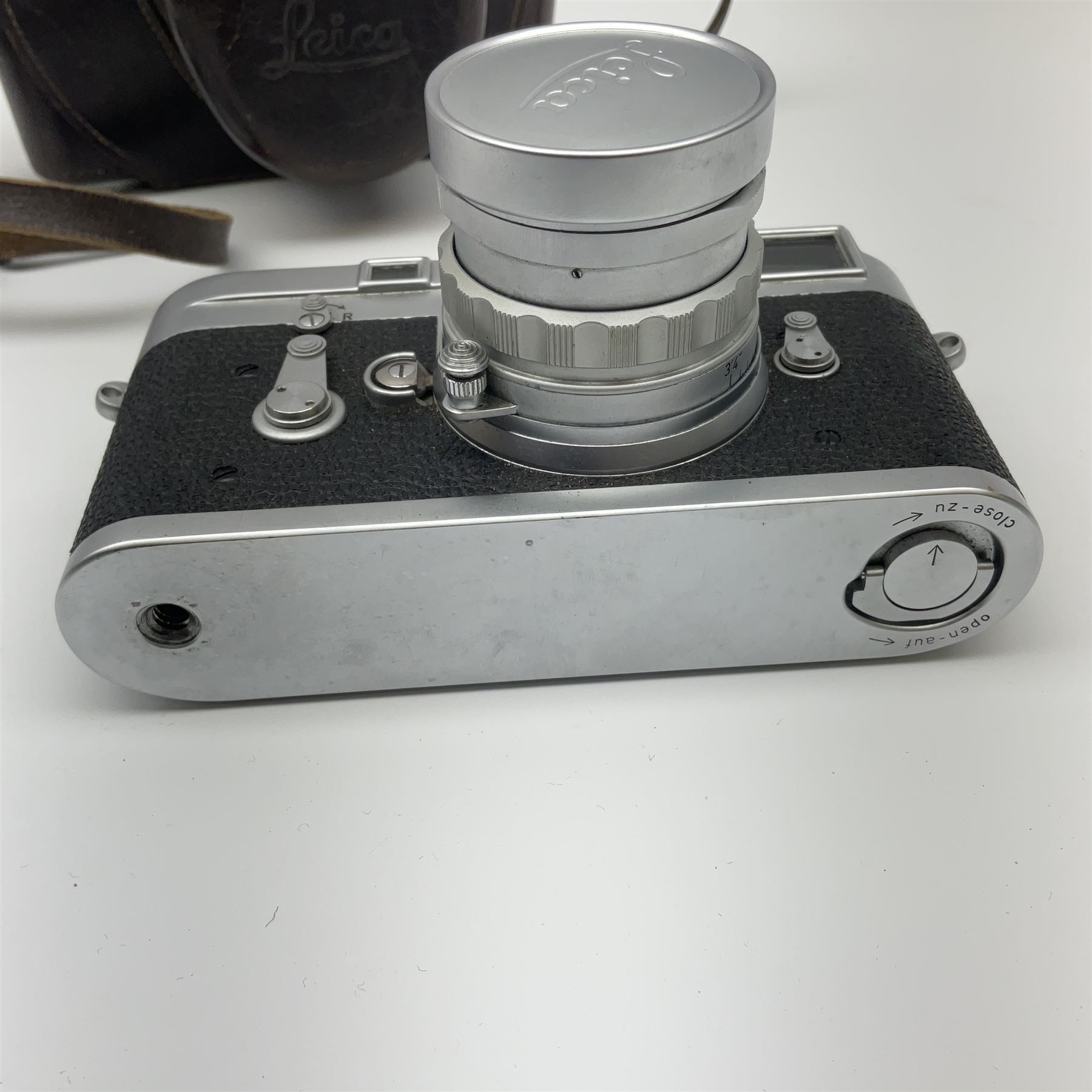 Leica M3 camera body, 1959, chrome finish, serial number '986937', fitted with 'Ernst Leitz GmbH Wetzlar Summicron f=5cm 1:2 Nr.1592614' lens, with Leica M3 instruction booklet