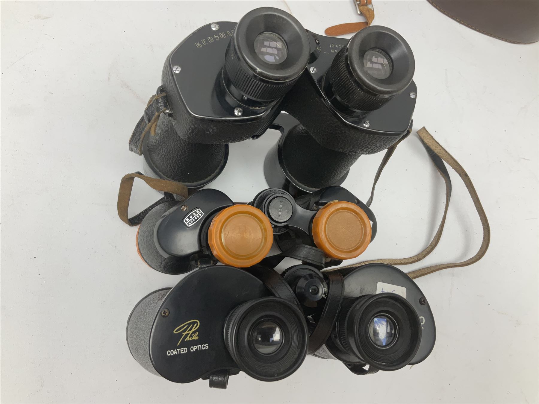 Ten cased pairs of binoculars, to include Ross London Steplux 7x50, Ross Solaross 16x60, Crescent zoom 7x- 12x50, Hilkinson 20x60,  Ross Stepnada 7x30,  Philo 10x50 etc
