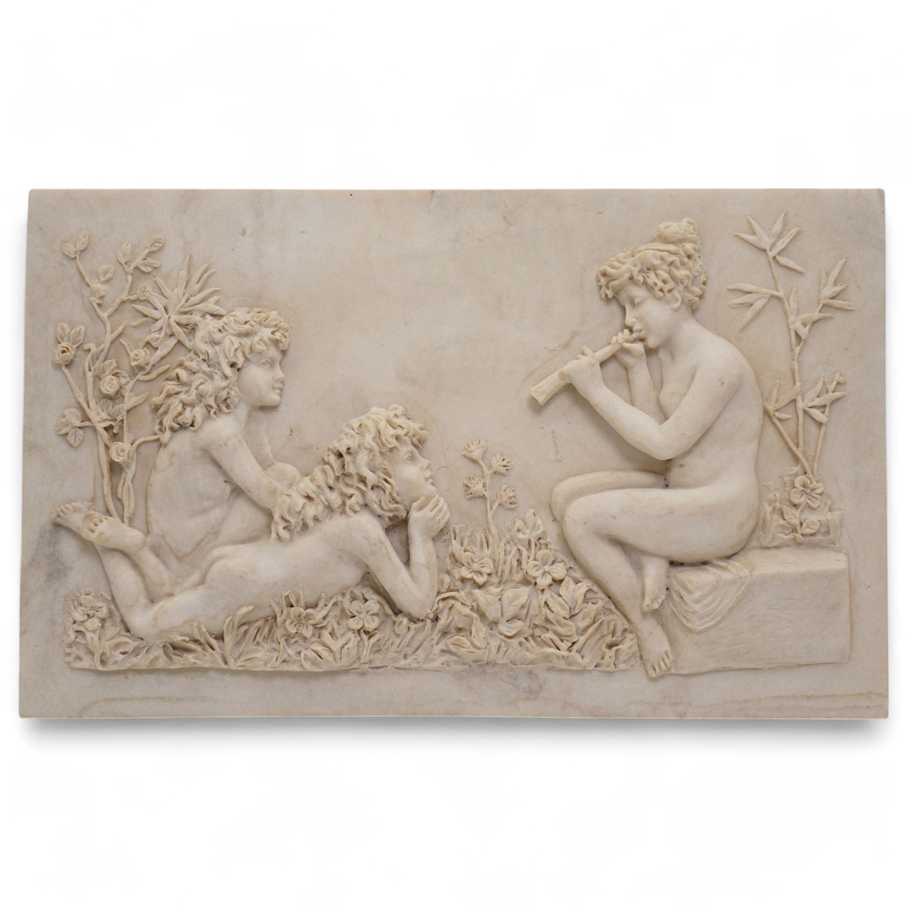 Composite plaque, depicting Sprites in a garden, with inset 'Arts and Commerce Promoted' medallion to reverse, 20cm x 33cm; together with a moulded glass Claret jug with silver plated mount H30cm 