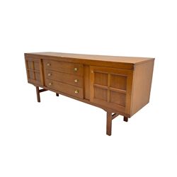 Elliotts of Newbury (EoN) - mid-20th century teak sideboard, fitted with three central drawers flanked by two cupboards, raised on square supports 