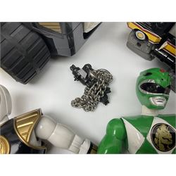 Collection of early 90s Mighty Morphin’ Power Rangers Zords, figures and accessories. Titanus the Carrier Zord, marked Bandai 1991; Green Dragonzord, incomplete; 1994 White Tigerzord with original instruction manual; 1993 Triceratops Dinozord, Mastodon Dinozord and Sabertooth Tiger Dinozord, Pterodactyl Dinozord, missing guns; with 1993 Power Morpher and original Power Coins, with further related figures, accessories and weapons