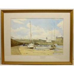  Thomas Hart (British 1830-1916): 'Castle Rock, Lynton', watercolour signed, titled on the mount, Geoffrey H Douthwaite (British 20th century): Scarborough Harbour, watercolour signed, and a drypoint etching of Chester indiscinctly signed in pencil, max 33cm x 47cm (3)  