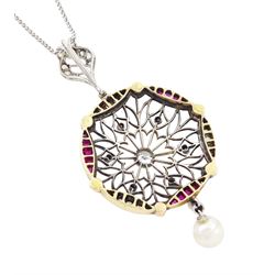 Early 20th century platinum and 18ct yellow gold ruby and diamond circular pendant, single old cut diamond of approx 0.25 carat, within a milgrain pierced fancy foliate surround, set with single cut diamonds, to a navette shaped border set with alternate calibre cut rubies and rose cut diamonds, each spaced by a single old cut diamond, suspending a pearl and diamond drop, on a later 18ct white gold wheat link chain necklace, hallmarked