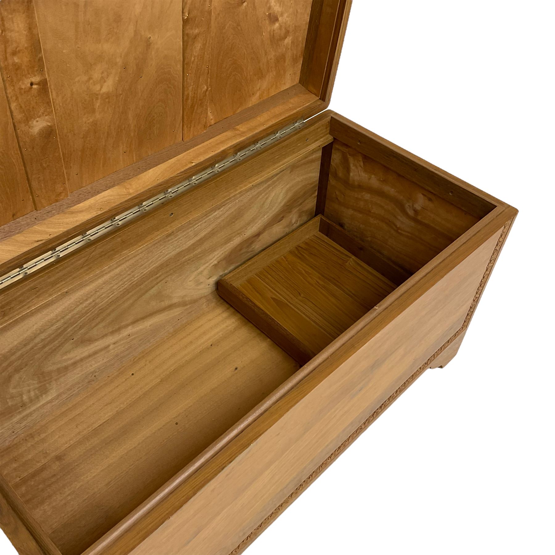 Mid-to-late 20th century Singapore camphor wood blanket chest, the hinged lid and front decorated with flower head carved bands