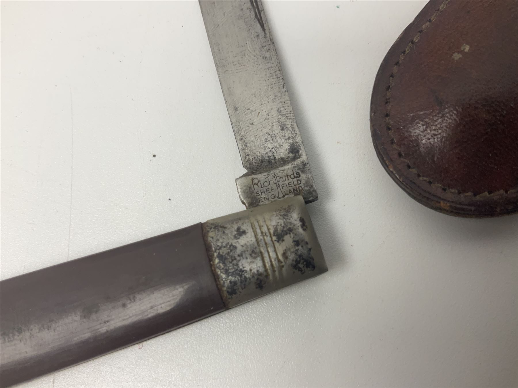 Seven pen knives, two lighters, including one Ronson example and a collection of postcards