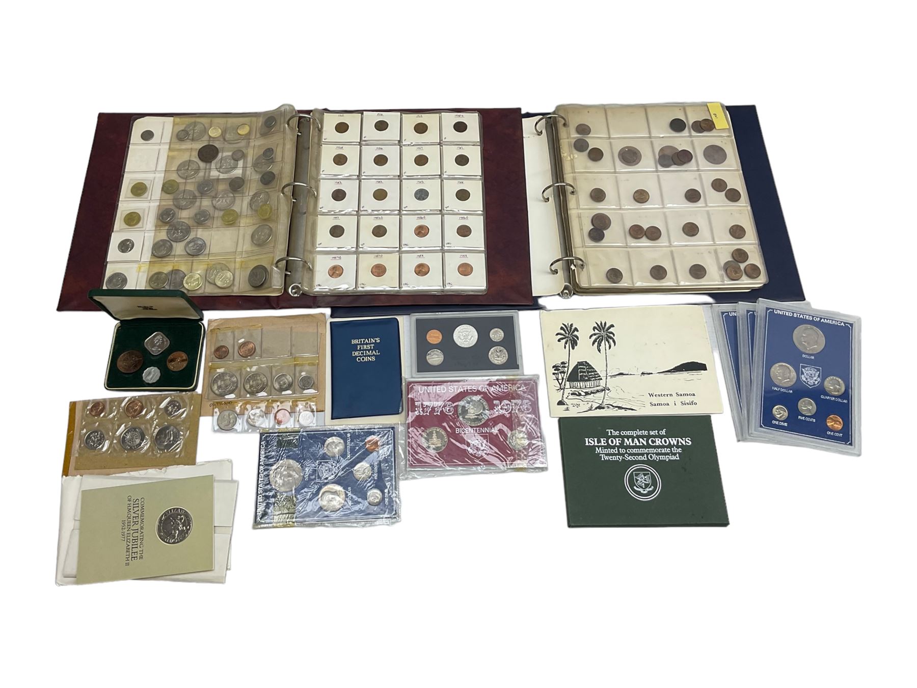 Great British and World coins, including various United States of America unofficial coin sets, Queen Elizabeth II Guernsey 1966 four coin set in The Royal Mint green case, Canada 1977 silver dollar, Isle of Man four coin crown set, Great British pre decimal coinage etc