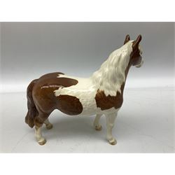 Three Beswick figure, comprising skewbald Pinto pony no. 1373, bay foal 'Another Star' no. 1727 and bay rearing horse no. 1014, all with printed mark beneath