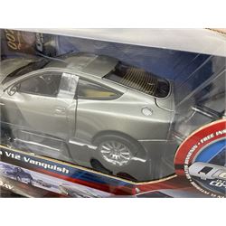 RCERTL Joyride James Bond 1:18th scale die-cast model cars - Lotus Esprit (silvered) from The Spy Who Loved Me, Aston Martin V12 Vanquish from Die Another Day and Chevrolet Corvette from A View To A Kill, all boxed (3)