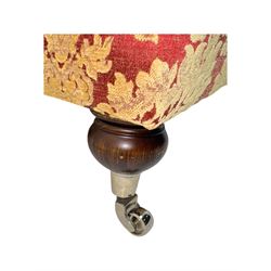 Duresta - pair of Grande three-seat sofas, traditional shaped with rolled arms and upholstered loose cushions, in red ground fabric with raised gold foliate pattern, on turned feet with brass castors 