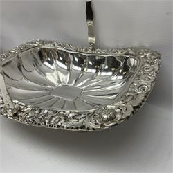 Edwardian silver plated swing handled basket, with pierced sides, engraved May 18 1904, with engraved initial A to handle, upon four ball and claw feet, together with other silver plated item including a similar swing handled basket, with embossed floral border, upon a rectangular pedestal, an egg coddler, with lion mask handles, hot water pot and a moulded glass biscuit barrel, coddler H22cm