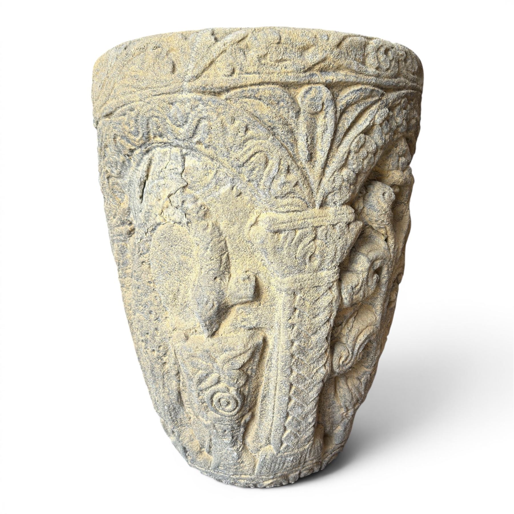 Cast stone Romanesque design urn of tapering form, decorated in relief with motifs of zoomorphic figures and swans within foliate and guilloche cast architectural arches with Neoclassical columns, in weathered finish