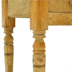 Victorian stripped pine table fitted with two drawers, supported on turned supports