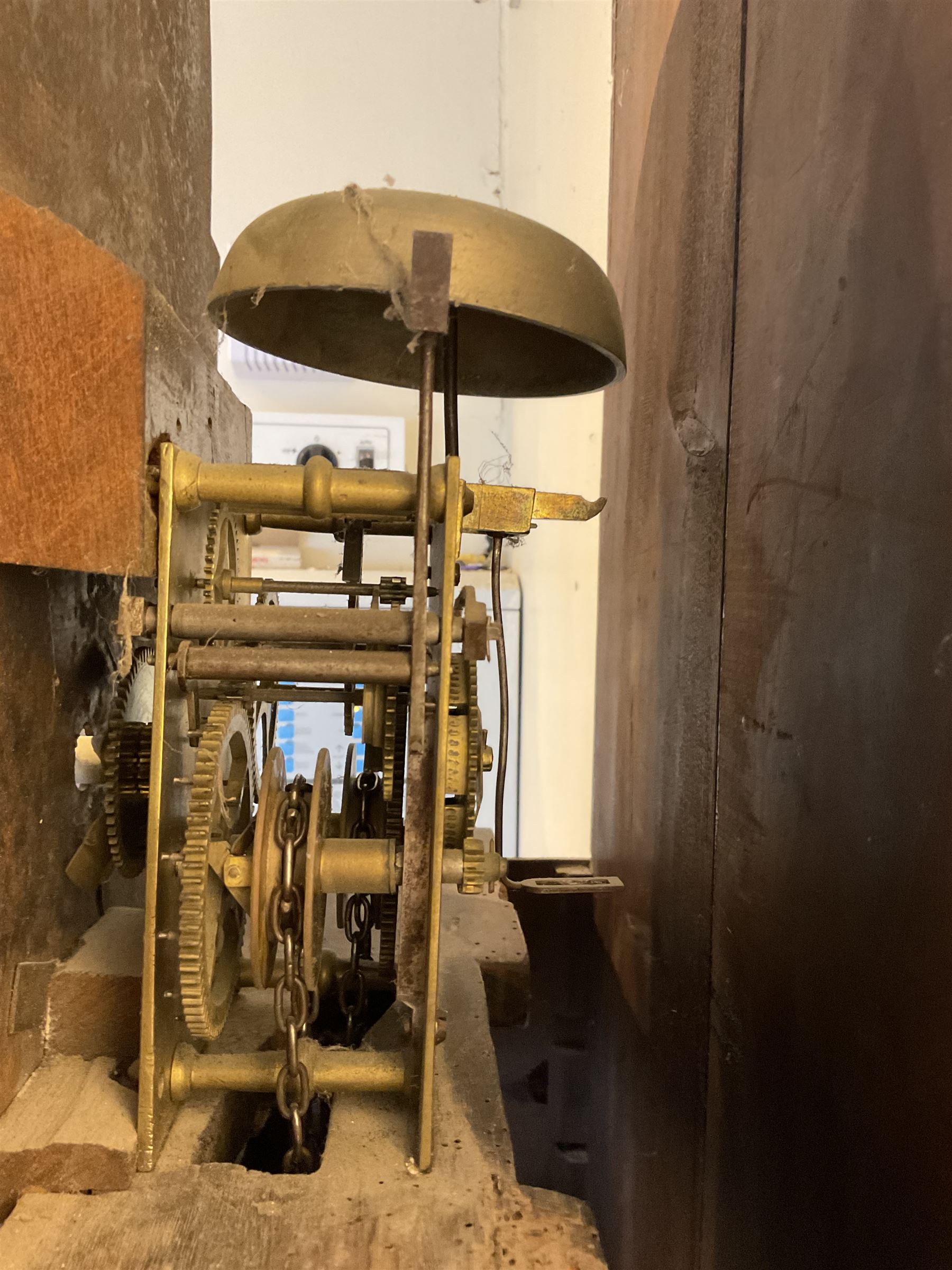 Late 19th century 30 hour Yorkshire mahogany longcase clock, with a swans necked pediment and break arch hood door flanked by two ring turned pilasters, trunk with a short door with a bone escutcheon on a wide plinth with a recessed panel, painted dial with a depiction of a sportsman to the arch and game birds to the spandrels, Roman numerals, minute markers and brass hands, chain driven countwheel striking movement. With weight and pendulum.