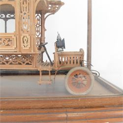 Early 20th century fretwork model of an omnibus, contained within glazed wooden case, case H45cm