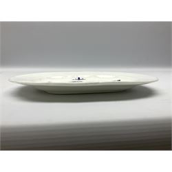 Three 19th century plates, comprising two circular examples and one oblong, each with osier moulded sides, the centres decorated in underglaze blue with Gillyflower type pattern, circular examples D25cm oblong example W27cm