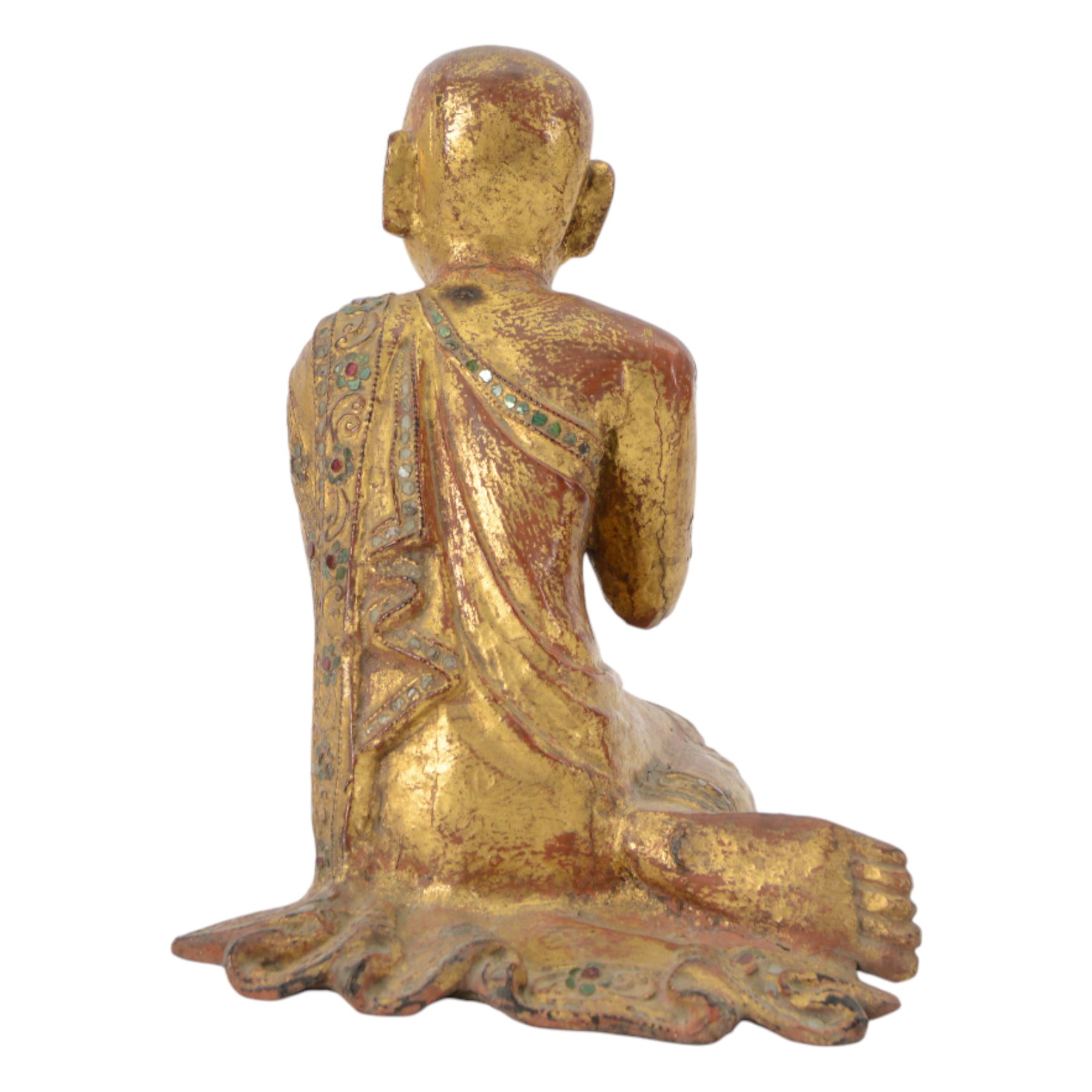 Late 19th century two Burmese Mandalay lacquered and gilt wood figures of monks, the robes edged with colored glass inlay and leafy scroll bands in raised lacquer, H25cm