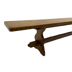 Gnomeman - adzed oak narrow bench, rectangular seat on shaped end supports united by pegged stretcher, carved with gnome signature, by Thomas Whittaker, Little Beck 