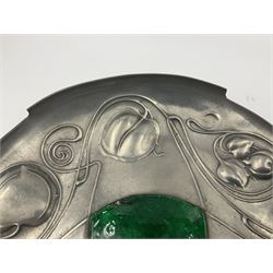 Liberty & Co Tudric pewter Bollelin tray, designed by Archibald Knox, of circular form with shaped edge, cast in relief with foliate tendrils surrounding a green enamel cartouche, impressed beneath Made by Library & Co English Pewter 044, D25.5cm