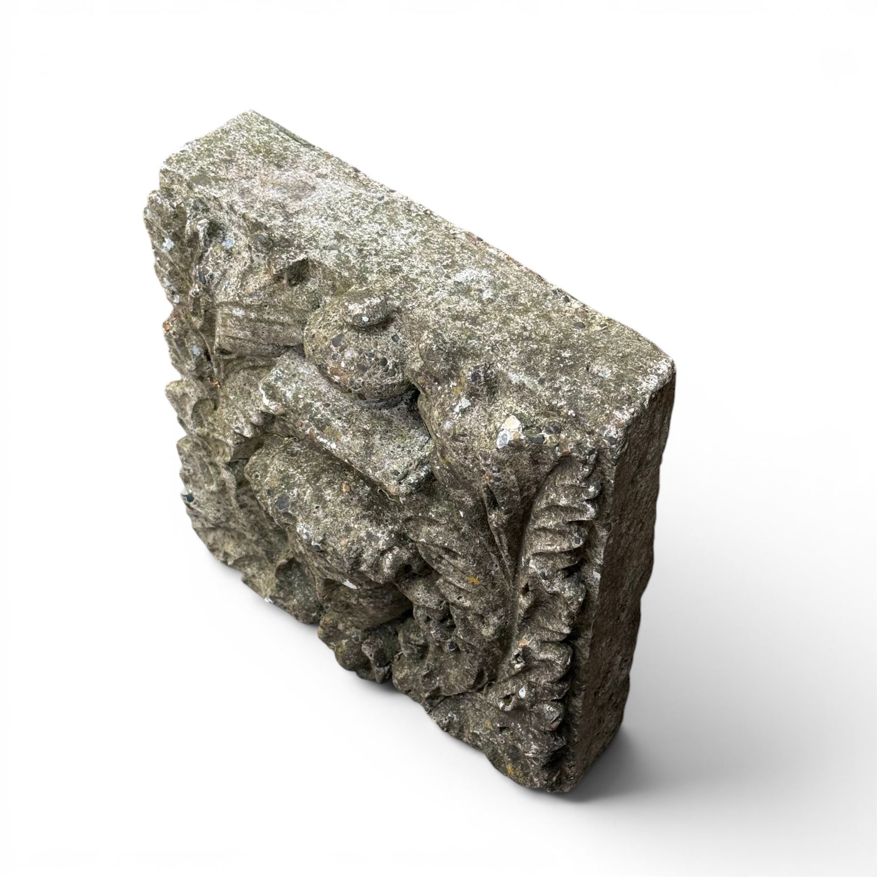 Weathered cast stone decorative wall panel, central female mask with urn motif surrounded by foliage