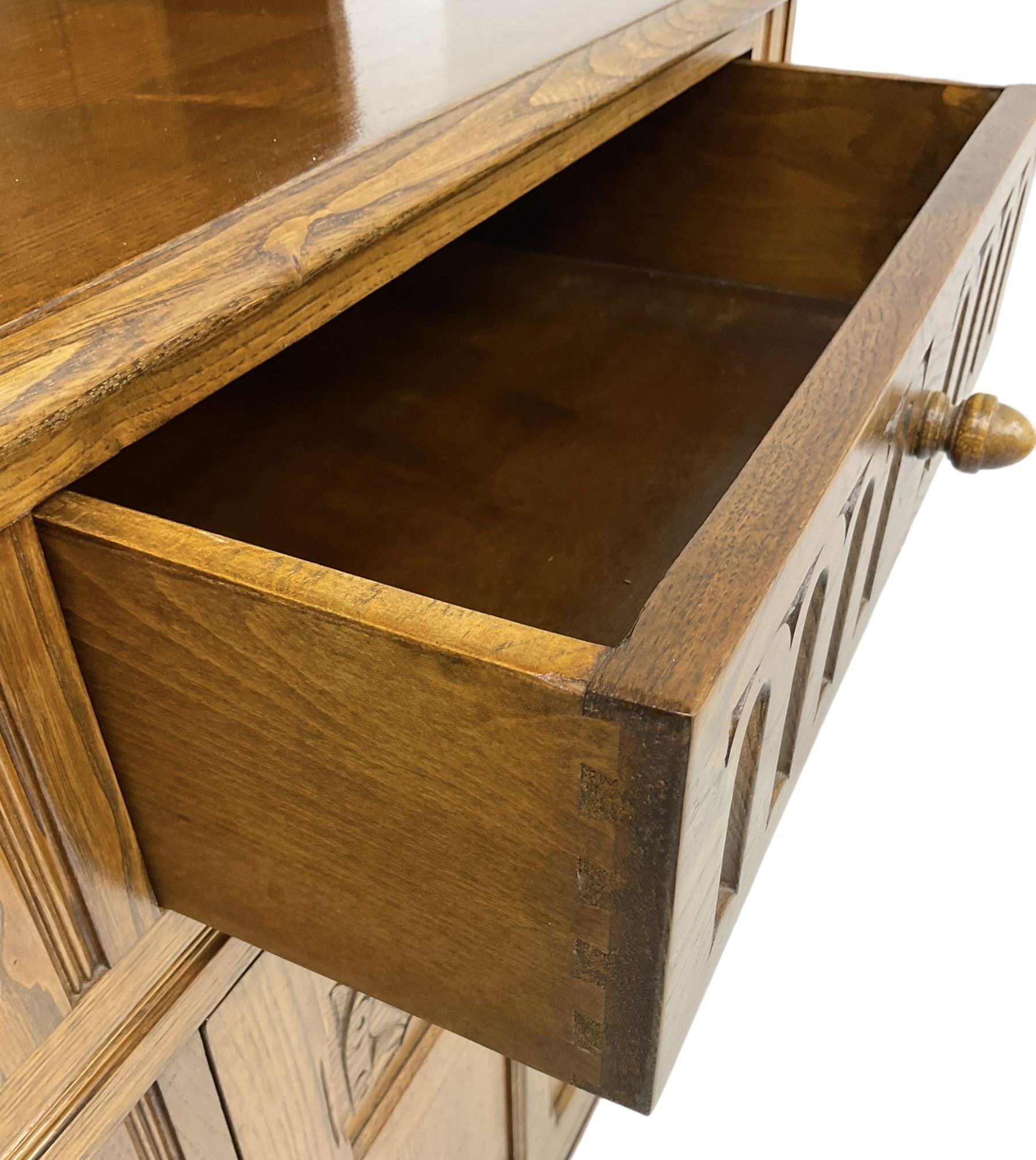 Mid-20th century oak dresser, raised two heights plate rack over two drawers and two cupboards