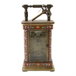 Late 20th century- Chinese 8-day timepiece carriage clock with Cloisonne work on a red ground to the four pillars, base and cornice, with painted porcelain panels to the sides, white enamel dial with Roman numerals and trefoil steel hands, platform escapement wound and set from the rear. With Key.