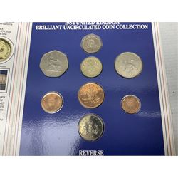 The Royal Mint United Kingdom 1984 brilliant uncirculated coin collection, 1997 and 2001 commemorative crown coins, 1997 old round one pound, all in card folders and four sterling silver medallic first day covers from the 'Great Britons' collection housed in a blue folder
