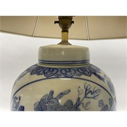 Chinese blue and white table lamp of baluster form, decorated with birds and floral displays, on hardwood base with shade, H78cm