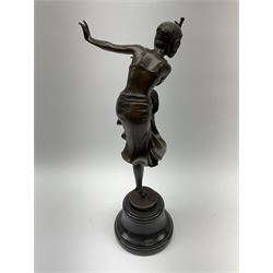 An Art Deco style bronze after Dimetri H Chiparus, modelled as a dancing flapper girl, signed and with foundry mark, upon black marble socle base, overall H39.5cm.