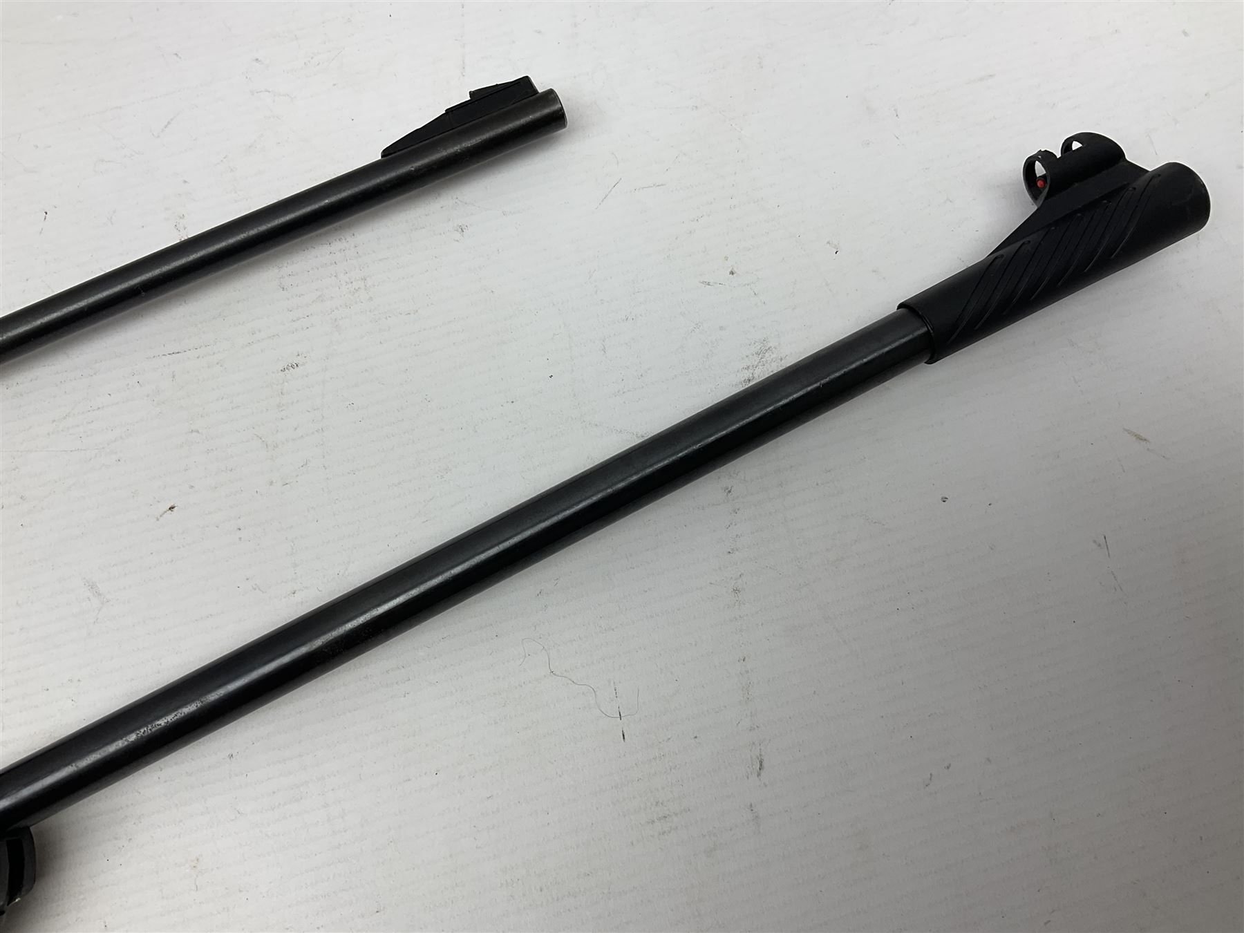 Crosman 760 .177 cal. Junior air rifle with under lever faux pump action and simulated wooden fittings; serial no.278047476, L90cm overall; and SMK B1 Synthetic .22 cal. Youth's air rifle with break-barrel action and 4 x 20 scope; serial no.1721229956084915F, L98.5cm overall (2)  NB: AGE RESTRICTIONS APPLY TO THE PURCHASE OF AIR WEAPONS.
