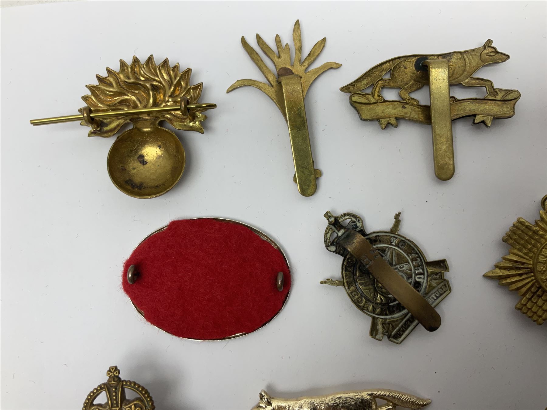 Twenty-six cap badges for Yeomanry and various guards including Fife & Forfar, Lothian and Border Horse, Leicestershire, Northamptonshire, Queens Own, Coldstream, Grenadier, Machine Gun Regiment, Life Guards etc (26)