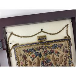 Continental petit point evening bag, with enamel and pearl details, in wooden display frame, together with a snake skin handbag and three other vintage bags