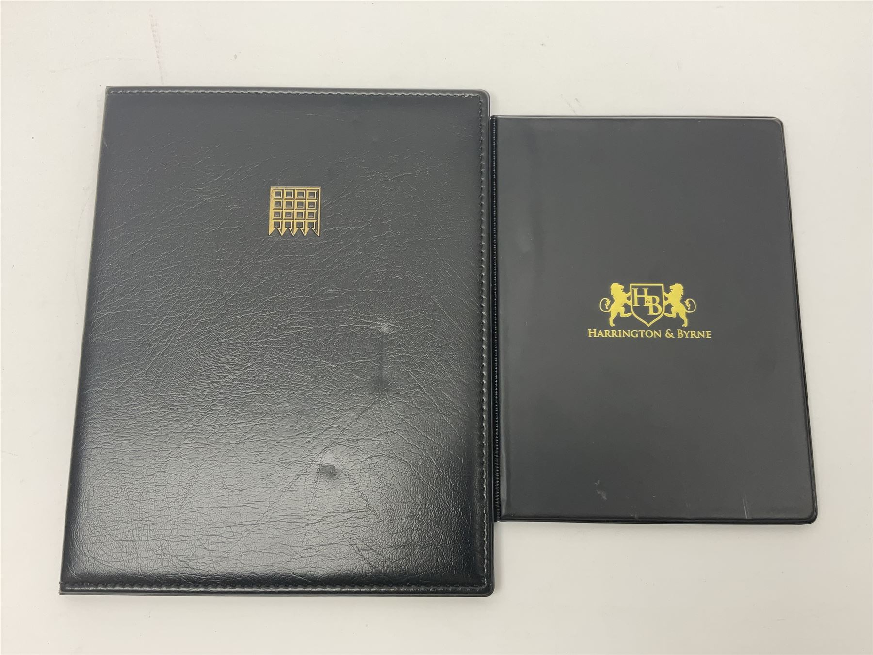 Great Britain Queen Victoria penny black stamp with black MX cancel and 1840 two pence blue stamp with black MX cancel, both housed in folders