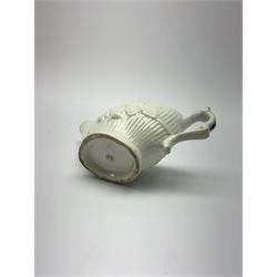 18th century reeded and foliate moulded cream boat, probably Liverpool, the interior decorated with floral sprigs, L12cm