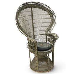 Mid-20th century wicker and rattan Peacock chair in unusual tones of dark olive and black, high fan back with a pieced and woven frame terminating to scrolled arms, with loose seat cushion