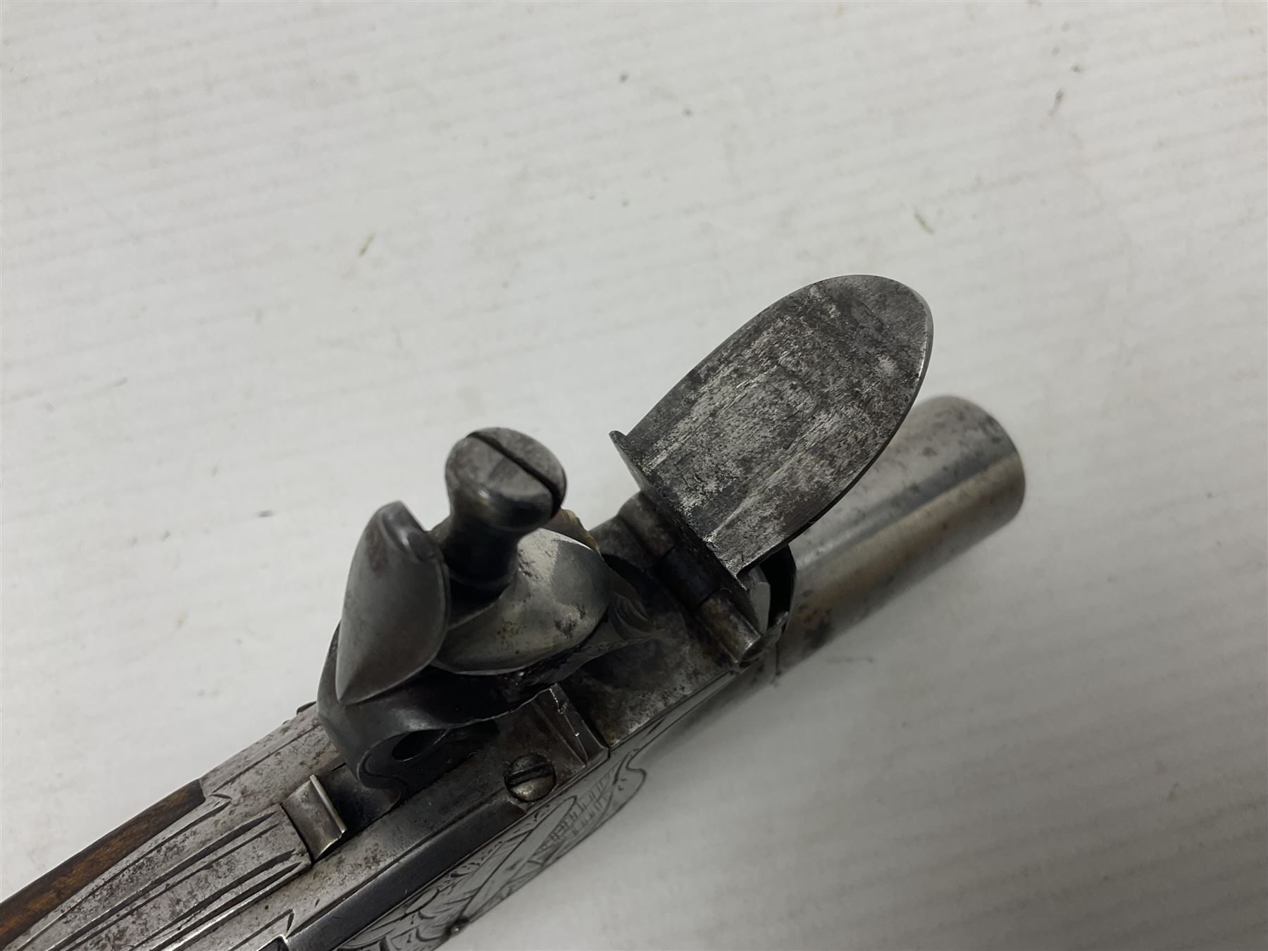 Early 19th century J. Calvert (Leeds) flintlock single barrel tap action pocket pistol, approximately .45 cal., the 4cm (originally) screw off barrel with top safety and walnut stock L16cm overall