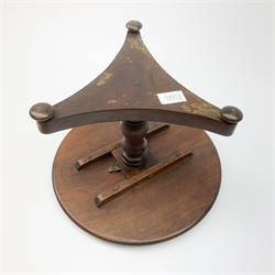A Victorian mahogany apprentice tilt top loo table, the trefoil base upon three compressed bun feet leading to a turned baluster column and moulded edge top, H17.5cm. 