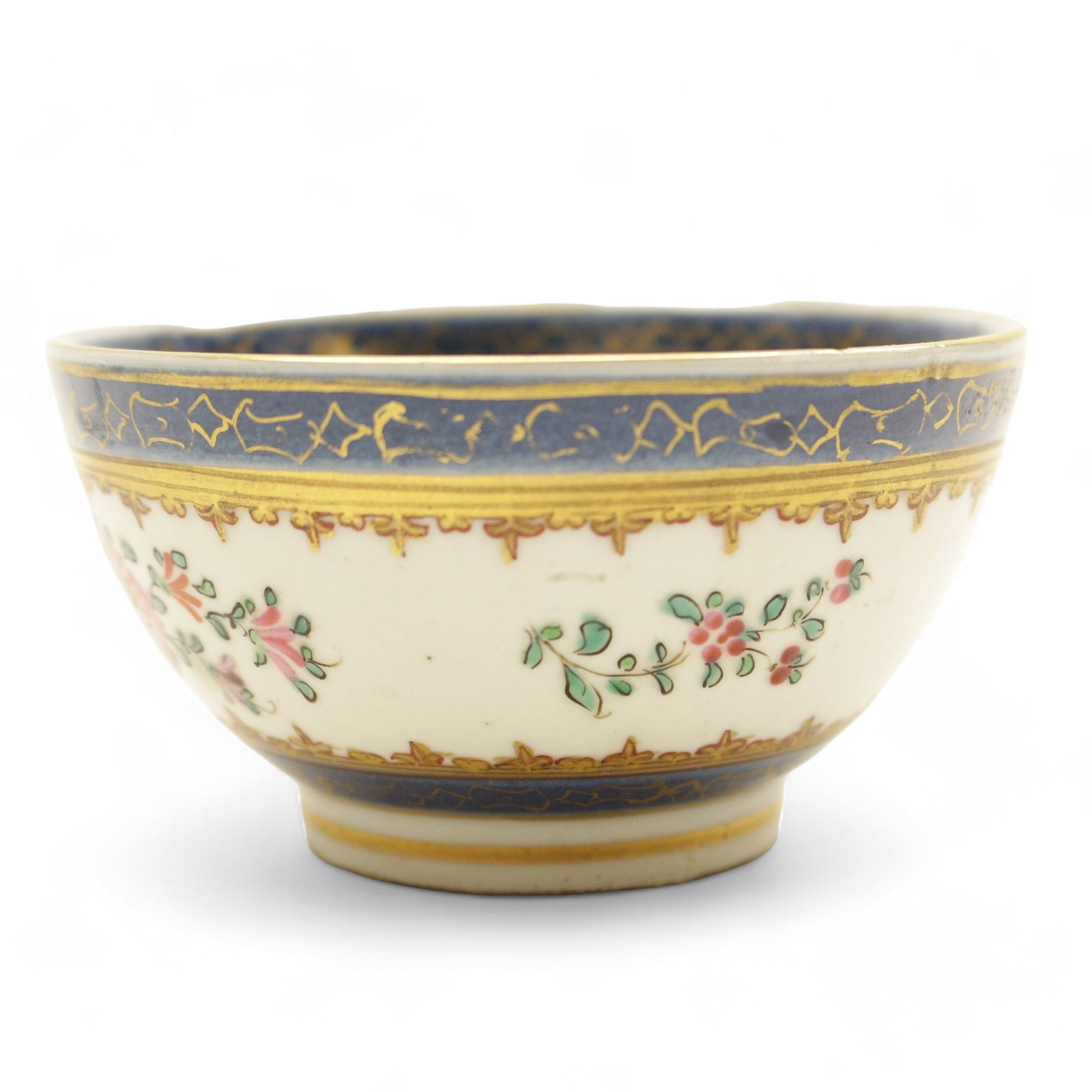 Chinese tea bowl, the enamel decoration depicting floral sprigs within a gilt and blue boarder, with a crowned shield to the centre, together with another bowl and a saucer
