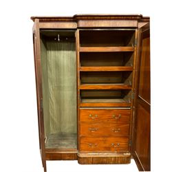 Victorian mahogany break front triple wardrobe, projecting moulded cornice over central mirror glazed door and two panelled doors, fitted with linen slides and three drawers, on plinth base