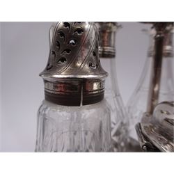 Late 18th century silver cruet stand, of oval form, with pierced sides upon four bun feet, hallmarked to handle Hester Bateman, all other hallmarks indistinct, together with five matched silver mounted cut glass cruet bottles, including some later Victorian examples, hallmarks predominantly indistinct, stand H20cm