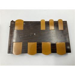 Edwardian silver mounted playing card case, hallmarked William Harrison Walter, Birmingham 1903, the sides each with a period playing card set behind a bevelled glass panel, the hinged cover with later engraving 'Presented to Norman T Crombie Esq by the officers & men of the 31st WR Detachment for services rendered 1917-1918', with red leather lined interior, the three compartments upon a sprung base and containing two later wooden Whist markers, case H12.5cm