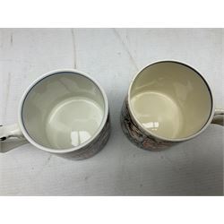 Two Dame Laura Knight coronation mugs for King George VI and Queen Elizabeth, comprising a Burleigh Ware example and a J&G Meakin example, each with a lion moulded handle and printed marks beneath, H8cm